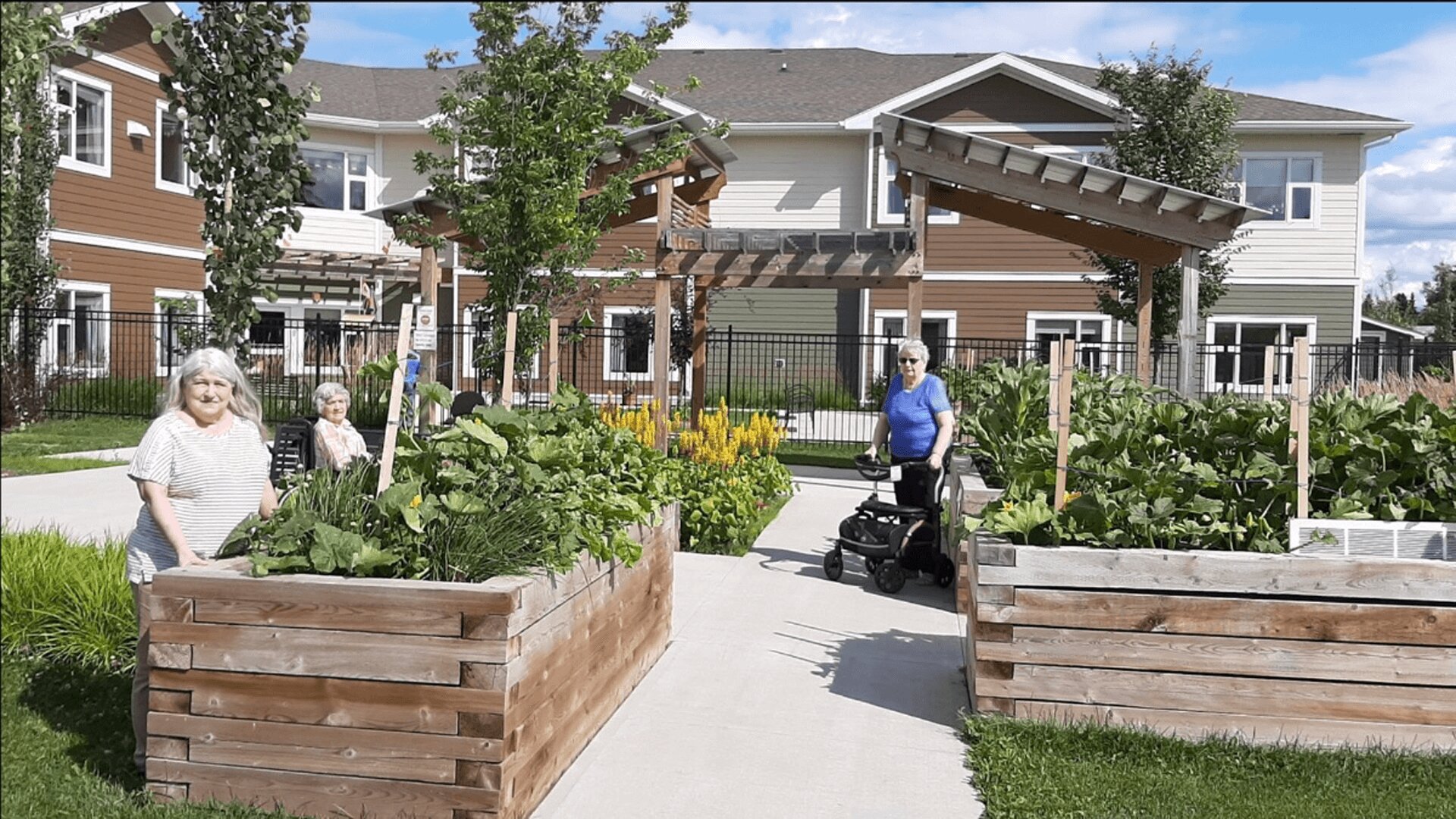 A group of ladies in the garden at a senior care home